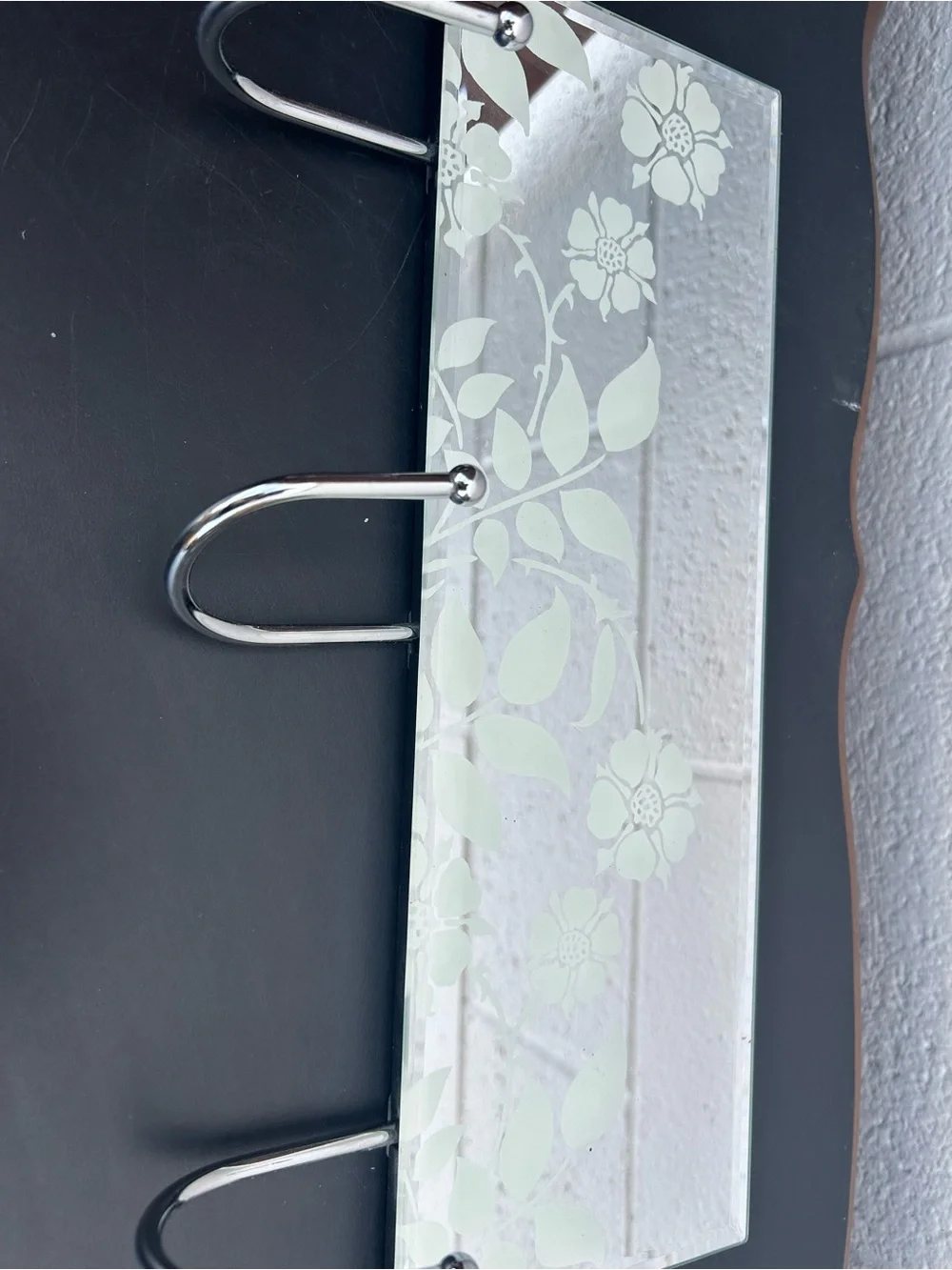 glass mirror coat rack featuring three chrome metal hooks and a delicate frosted